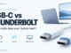 USB-C connectors beside a laptop and monitor on a light background, with charging, data, and display labels.